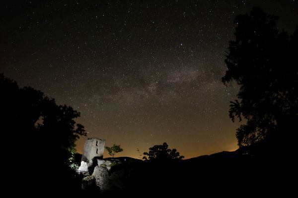 Ruins of an old castle at night.