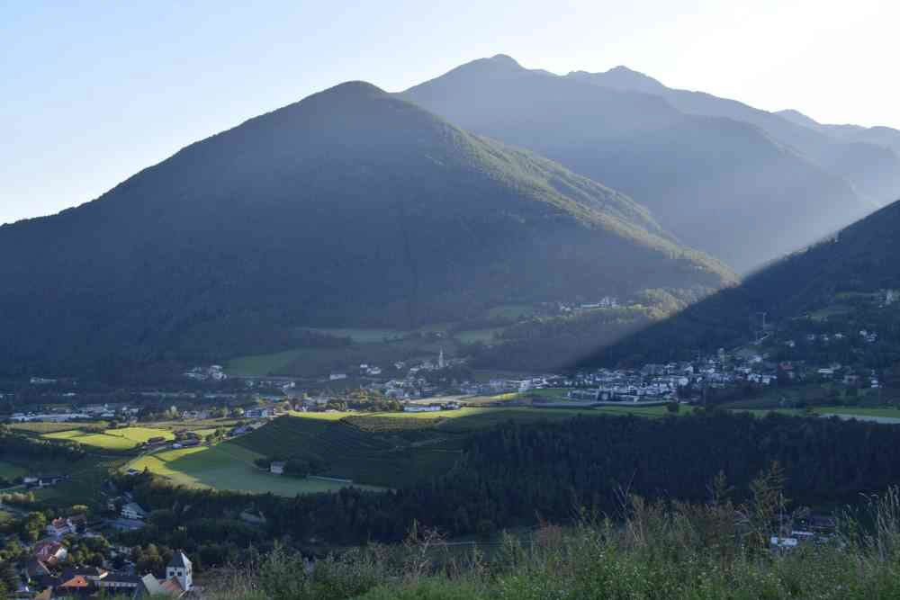 Setting sun above a valley in south tirol.