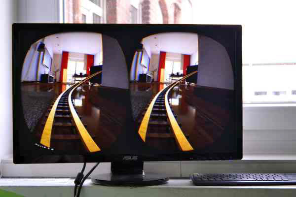 A Screen showing a Virtual Reality projection of a rollercoaster ride on a monitor.